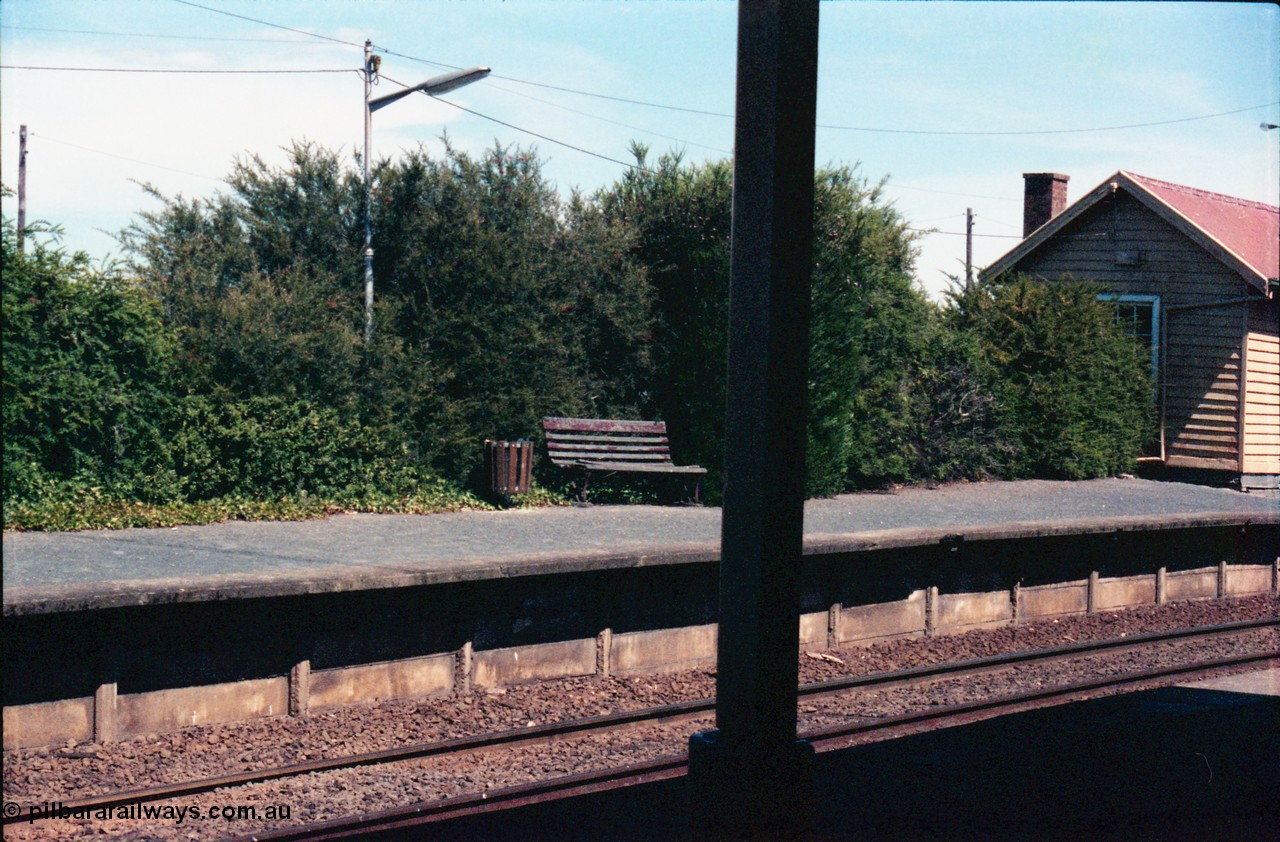 145-17
Wallan, up or No.2 platform, showing bench, hedge, platform coping and edge of waiting room.
