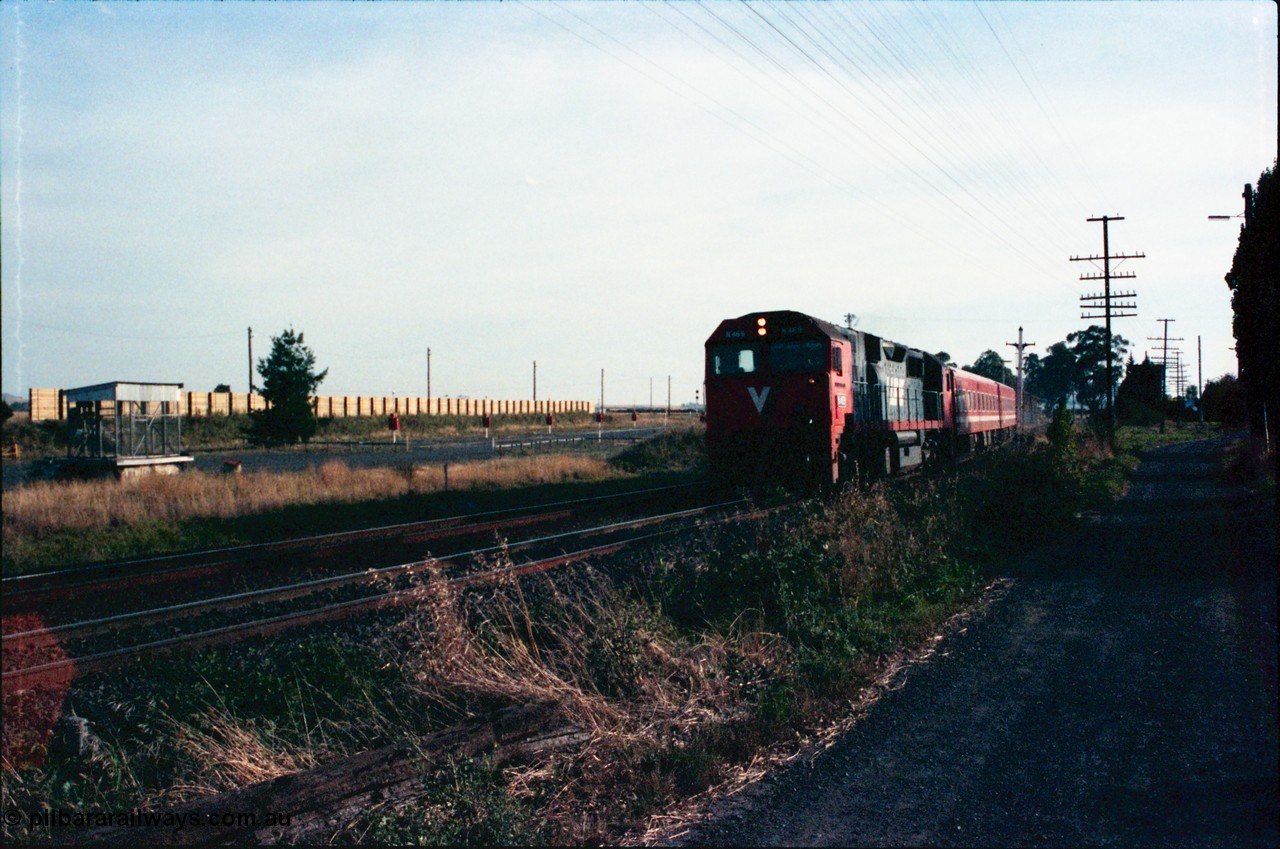 145-25
Wallan, down broad gauge passenger train hauled by V/Line N class N 469 'City of Morwell' Clyde Engineering EMD model JT22HC-2 serial 86-1198 and N set past the remains of disc signal post 15, at left is the 'Gang Camp' area with sound proofing wall.
Keywords: N-class;N469;Clyde-Engineering-Somerton-Victoria;EMD;JT22HC-2;86-1198;