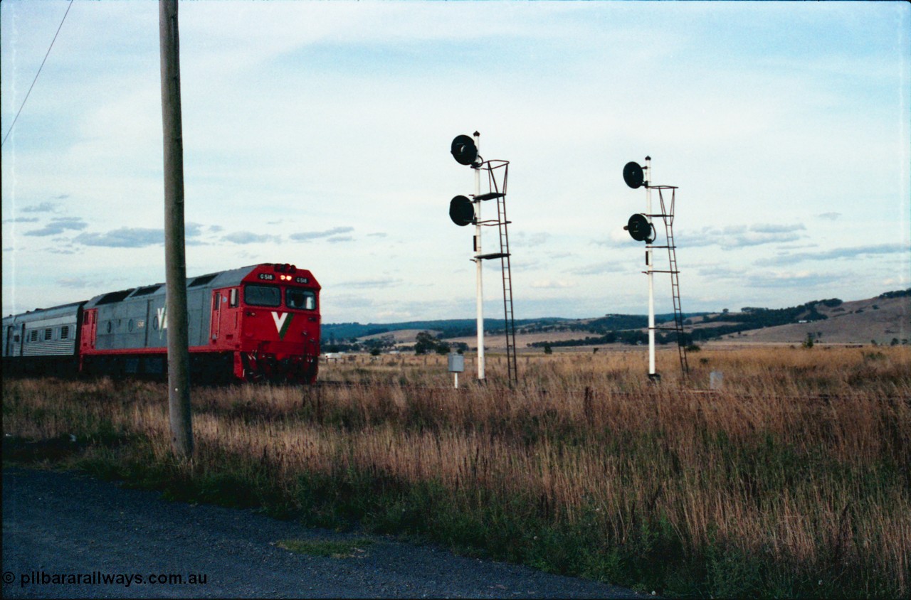 145-27
Wallan Loop, south end of standard gauge loop, V/Line G class G 518 Clyde Engineering EMD model JT26C-2SS serial 85-1231 leads the up Inter-Capital Daylight, shows both up home searchlight signal masts.
Keywords: G-class;G518;Clyde-Engineering-Rosewater-SA;EMD;JT26C-2SS;85-1231;