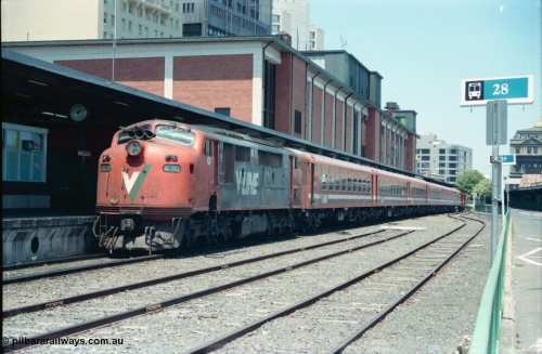 145-04
Spencer Street Station dual gauge Platform Number 1, broad gauge V/Line A class A 70 Clyde Engineering EMD model AAT22C-2R serial 84-1187 rebuilt from B 70 Clyde Engineering EMD model ML2 serial ML2-11 with double N set.
Keywords: A-class;A70;Clyde-Engineering-Rosewater-SA;EMD;AAT22C-2R;84-1187;rebuild;bulldog;