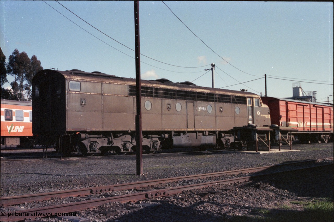 147-06
Seymour loco depot turntable roads, Victorian Railways liveried S class S 303 'C J Latrobe' Clyde Engineering EMD model A7 serial 57-167 and V/Line D type bogie louvre van D 310, a couple of dynamic brake grid assemblies are next to S 303.
Keywords: S-class;S303;Clyde-Engineering-Granville-NSW;EMD;A7;57-167;bulldog;