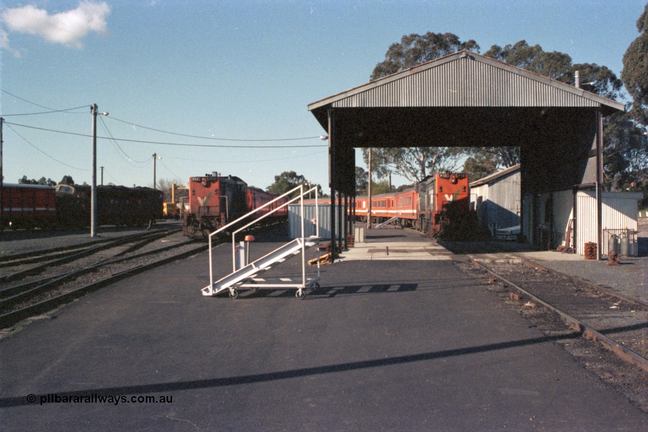 147-09
Seymour loco depot broad gauge carriage cleaning and storage area, Victorian Railways liveried S class S 303 'C J Latrobe' Clyde Engineering EMD model A7 serial 57-167 at far left and V/Line P classes P 11 Clyde Engineering EMD model G18HBR serial 84-1205 rebuilt from T 336 Clyde Engineering EMD model G8B serial 56-110 and P 12 serial 84-1206 rebuilt from T 329 serial 56-82 on stabled H set commuter trains.
Keywords: P-class;Clyde-Engineering-Somerton-Victoria;EMD;G18HBR;