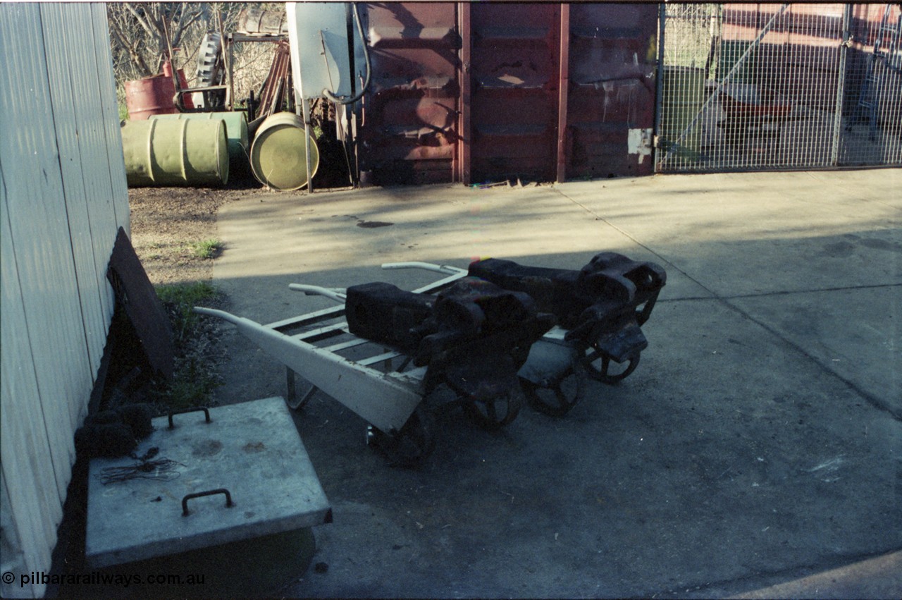 147-20
Seymour loco depot, draw gear or couplers sitting on trolleys out the side of the workshop.
