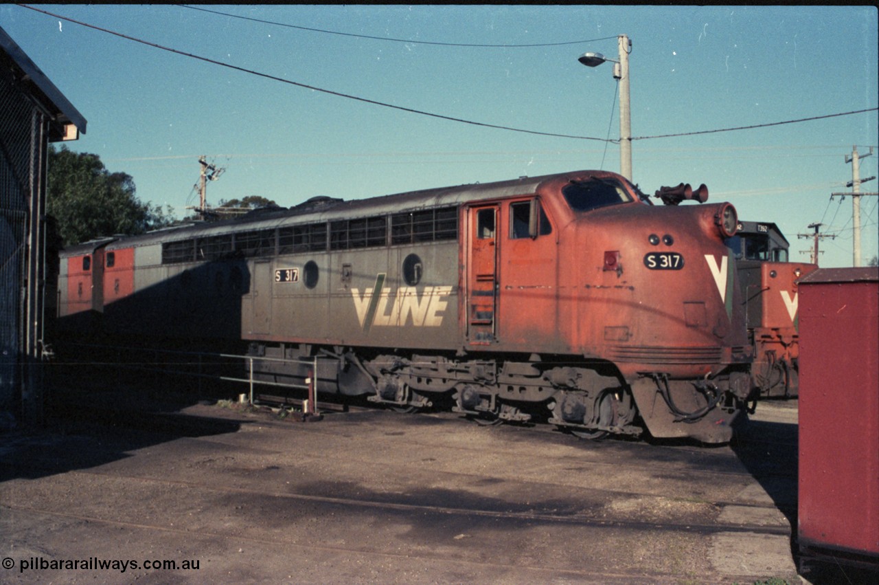 147-24
Seymour loco depot, broad gauge V/Line S class S 317 'Sir John Monash' Clyde Engineering EMD model A7 serial 61-240 sits around the turntable coupled to sister A7 model S 310.
Keywords: S-class;S317;Clyde-Engineering-Granville-NSW;EMD;A7;61-240;bulldog;