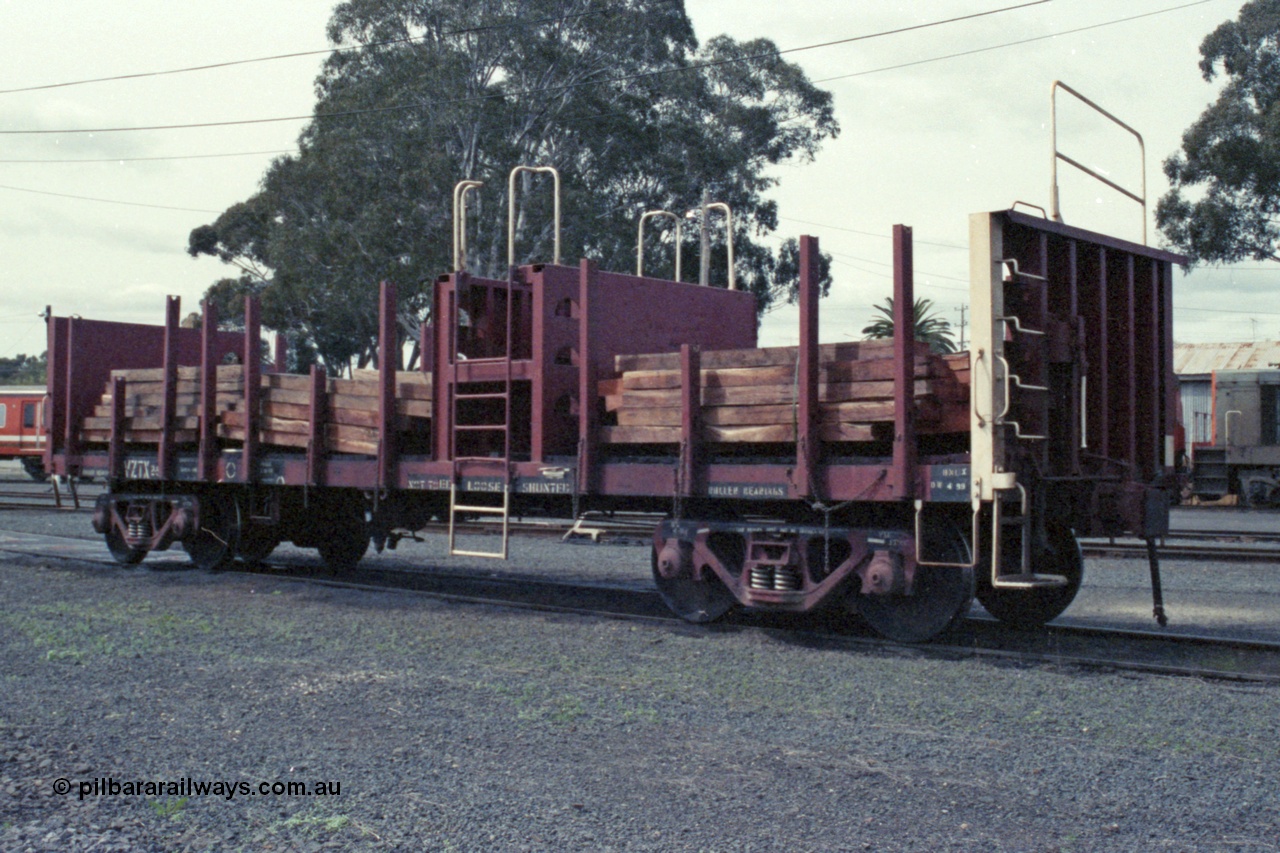 147-32
Seymour loco depot, a loaded V/Line VZTX type bogie sleeper transport waggon VZTX 2, started out as BP type Steel Mail/Baggage Van BP 77 built in 1959 by Newport Workshops, went on to become VBAX 2 in 1979, then converted 1990 to VZTX type.
Keywords: VZTX-type;VZTX2;Victorian-Railways-Newport-WS;BP-type;VBAX-type;