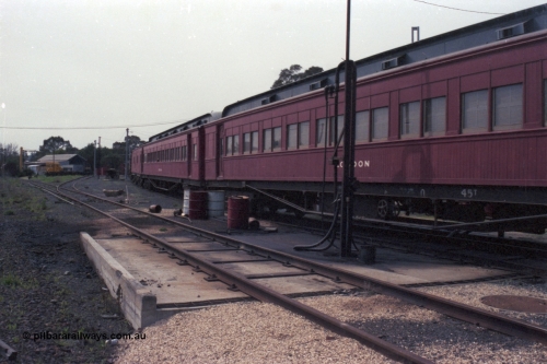 147-34
Seymour loco depot, stabled train, former Joint Stock Sleeper, No.10 Sleeper 'LODDON' at the fuel point, originally built in 1907 and called 'MELBOURNE', renamed in 1910, removed from Joint Stock in 1969 and named No. 10, then around 1984 renamed 'LODDON' in 'Train of Knowledge' service, with another Joint Stock Sleeper 'Pekina' and what looks like 'Carey'. This would no doubt be the 'Train of Knowledge'.
Keywords: E-class;Loddon;Victorian-Railways-Newport-WS;Joint-Stock;Melbourne-Sleeper;