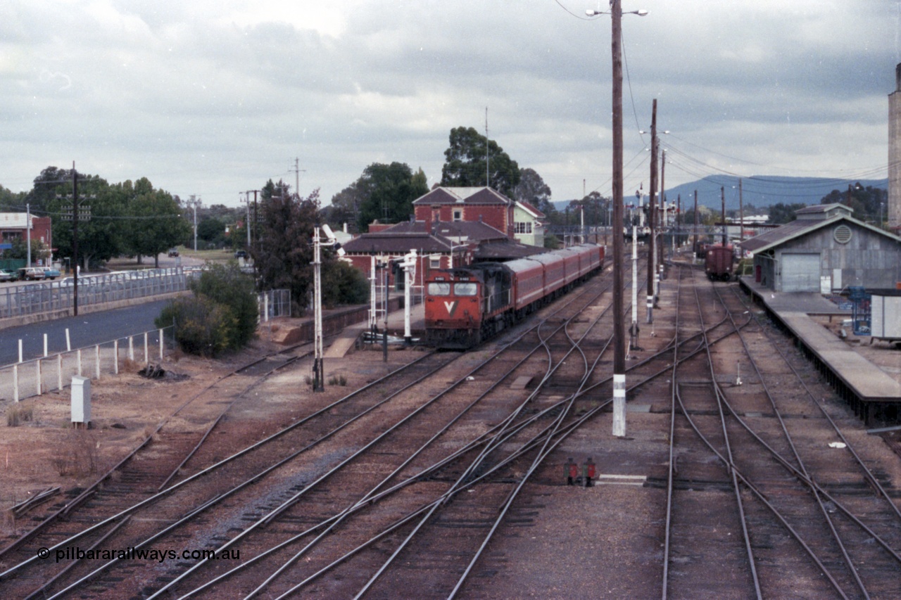 148-07
Wangaratta yard view with V/Line broad gauge N class N 460 'City of Castlemaine' Clyde Engineering EMD model JT22HC-2 serial 85-1228 on down Albury passenger at the station.
Keywords: N-class;N460;Clyde-Engineering-Somerton-Victoria;EMD;JT22HC-2;85-1228;