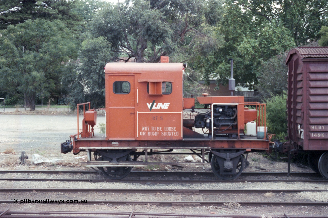 148-09
Wangaratta, V/Line rail tractor RT 5 and VLBY type louvre van VLBY 148 on No.5 Rd, side view. RT 5 built new by Newport Workshops September 1957. The VLBY which is the Wangaratta parcels waggon started out being built by Newport Workshops October 1956 as a VP type VP 148, in May 1979 re-coded to VLPY, re-coded again in 1982 to VLBY.
Keywords: RT-class;RT5;Victorian-Railways-Newport-WS;VLBY-type;VLPY-type;VP-type;VLBY148