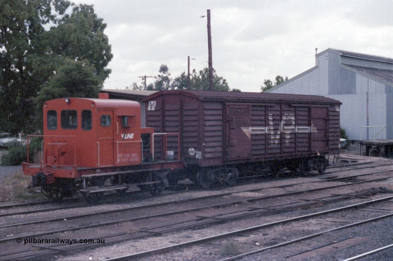 148-10
Wangaratta, V/Line rail tractor RT 5 and VLBY type louvre van VLBY 148 on No.5 Rd, goods shed behind and point rodding in foreground, cover for automatic electric staff exchanger visible. RT 5 built new by Newport Workshops September 1957. The VLBY which is the Wangaratta parcels waggon started out being built by Newport Workshops October 1956 as a VP type VP 148, in May 1979 re-coded to VLPY, re-coded again in 1982 to VLBY.
Keywords: RT-class;RT5;Victorian-Railways-Newport-WS;VLBY-type;VLPY-type;VP-type;VLBY148