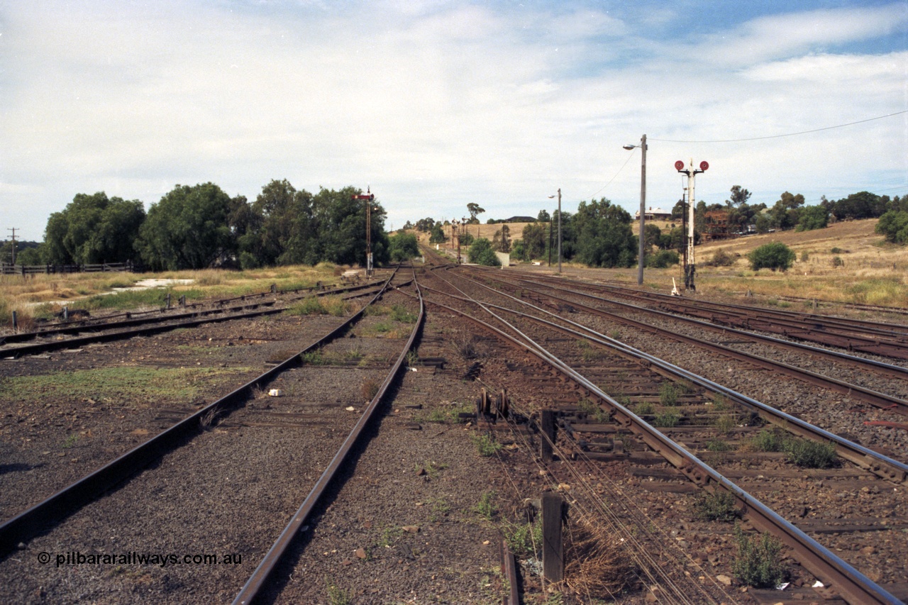 149-09
Bacchus Marsh yard overview looking towards Melbourne, taken from Dock Rd, Siding D to turntable at left, Signal posts 4 and 3 with post 2 just visible beyond the gangers trolley shed.
