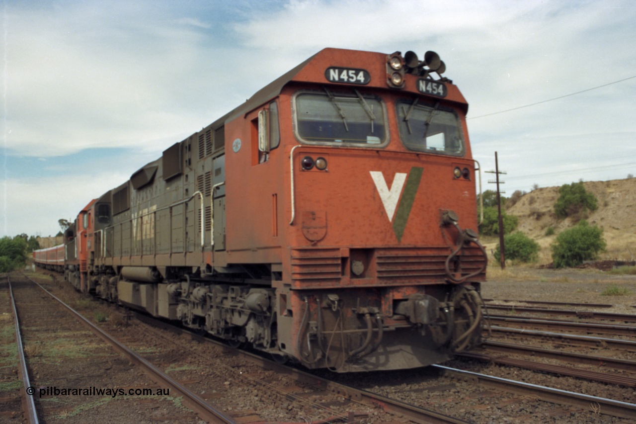 149-23
Bacchus Marsh, V/Line broad gauge N class N 454 'City of Horsham' Clyde Engineering EMD model JT22HC-2 serial 85-1222 with second sister unit on down passenger onto No.1 Rd.
Keywords: N-class;N454;Clyde-Engineering-Somerton-Victoria;EMD;JT22HC-2;85-1222;