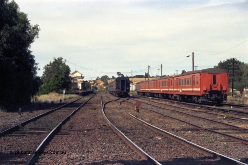 149-19
Bacchus Marsh station yard overview with stabled passenger sets looking down mainline towards Melbourne.
