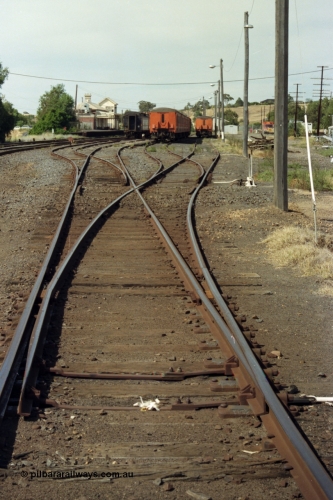 149-20
Bacchus Marsh station yard overview with stabled passenger sets looking Up direction at Nos. 3, 4, 5 and 6 Roads towards Melbourne, station and elevated signal box visible in the background.
