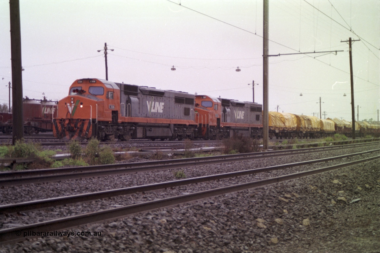 150-01
Tottenham yard, V/Line broad gauge C class locos C 506 Clyde Engineering EMD model GT26C serial 76-829 and C 510 serial 76-833 prepare their Adelaide bound goods train 9169 in rain as departure time approaches.
Keywords: C-class;C506;Clyde-Engineering-Rosewater-SA;EMD;GT26C;76-829;