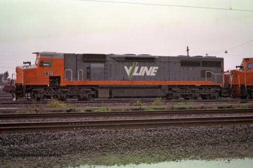 150-03
Tottenham yard, V/Line broad gauge C class loco C 506 Clyde Engineering EMD model GT26C serial 76-829 heads up Adelaide bound goods train 9169 in rain as departure time approaches, side view.
Keywords: C-class;C506;Clyde-Engineering-Rosewater-SA;EMD;GT26C;76-829;