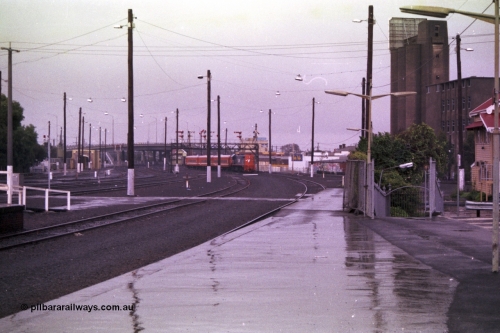 150-04
Geelong, V/Line broad gauge X class X 32 Clyde Engineering EMD model G16C serial 66-485 leads down Melbourne - Geelong passenger train 8229 into Geelong station, under the signal gantry with post 19B pulled off for it to run into the platform, post 17 is pulled off for the run around movement.
Keywords: X-class;X32;Clyde-Engineering-Granville-NSW;EMD;G16C;66-485;