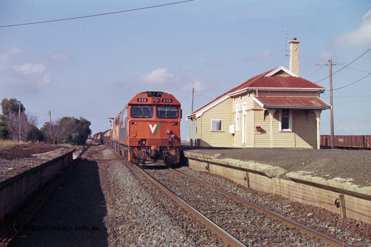 151-13
Gheringhap, broad gauge V/Line Adelaide bound goods train 9169 holds No.1 Road with G class G 531 Clyde Engineering EMD model JT26C-2SS serial 88-1261 leading C classes C 510 Clyde Engineering EMD model GT26C serial 76-833 and C 509 serial 76-832, point rodding and signal wires can been seen in this shot taken from the former No.2 road pit, gypsum waggons in the background.
Keywords: G-class;G531;Clyde-Engineering-Somerton-Victoria;EMD;JT26C-2SS;88-1261;