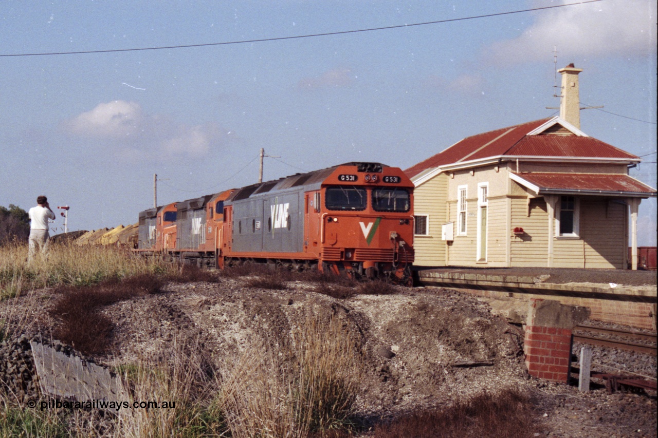 151-14
Gheringhap, broad gauge V/Line Adelaide bound goods train 9169 on No.1 Road under the power of G class G 531 Clyde Engineering EMD model JT26C-2SS serial 88-1261, C class C 510 Clyde Engineering EMD model GT26C serial 76-833 and C 509 serial 76-832, this shot taken from the former No.2 platform.
Keywords: G-class;G531;Clyde-Engineering-Somerton-Victoria;EMD;JT26C-2SS;88-1261;