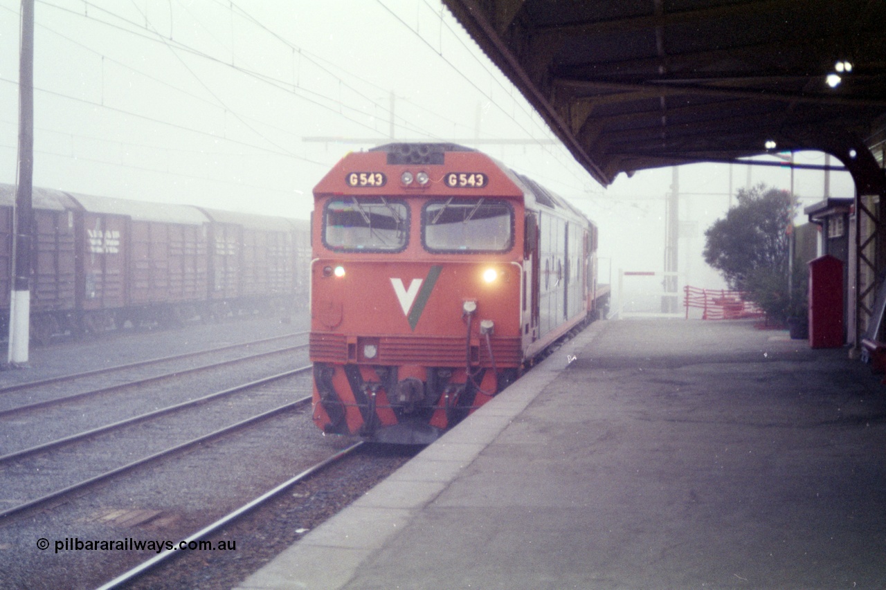 151-20
Traralgon station platform, V/Line broad gauge G class G 543 Clyde Engineering EMD model JT26C-2SS serial 89-1276 light engine with an X class awaits departure time on 9444 light engine to Morwell and then loaded briquette train to Nth Geelong in heavy fog.
Keywords: G-class;G543;Clyde-Engineering-Somerton-Victoria;EMD;JT26C-2SS;89-1276;