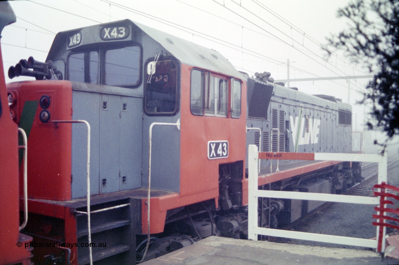 151-21
Traralgon station platform, V/Line broad gauge light engine 2nd unit X class X 43 Clyde Engineering EMD model G26C serial 70-706 awaits departure time for Morwell with 9444 light engine, then loaded briquette train for Nth Geelong, in heavy fog.
Keywords: X-class;X43;Clyde-Engineering-Granville-NSW;EMD;GT26C;70-706;