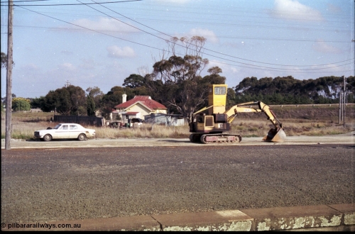 151-11
Gheringhap, view across yard from station platform looking at unloading contraption for extracting gypsum out of open waggons, and my HK Holden, the little four pane window is the start of the Gheringhap Loop train sightings page.
