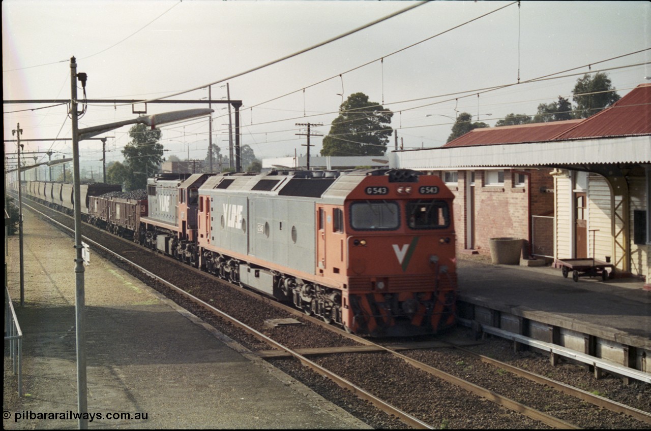 152-10
Trafalgar station, V/Line broad gauge train 9444 goods to Nth Geelong behind G class G 543 Clyde Engineering EMD model JT26C-2SS serial 89-1276 and X class X 43 Clyde Engineering EMD model G26C serial 70-706, rolls through the up platform, taken from the down station platform.
Keywords: G-class;G543;Clyde-Engineering-Somerton-Victoria;EMD;JT26C-2SS;89-1276;