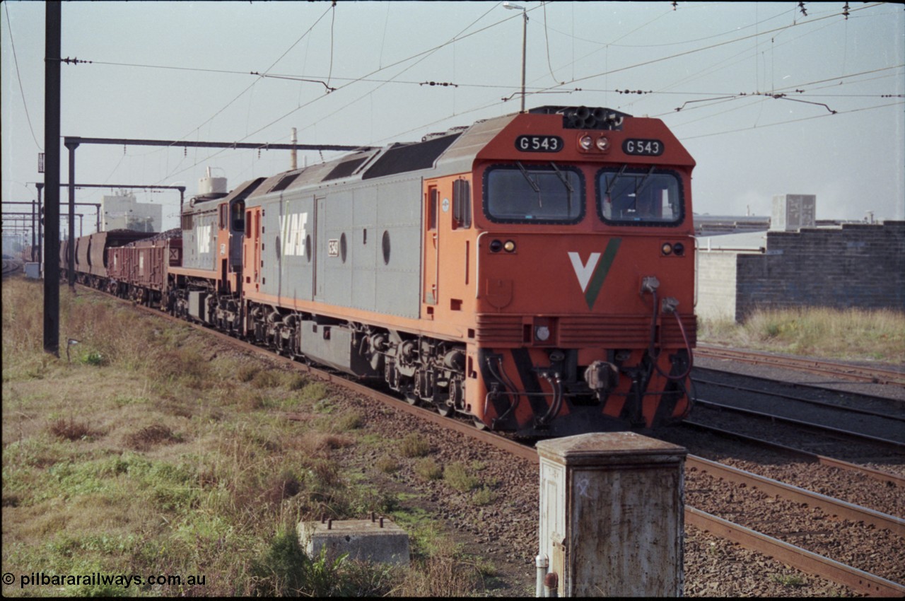 152-11
Pakenham station, V/Line broad gauge up 9444 goods to Nth Geelong arrives behind G class G 543 Clyde Engineering EMD model JT26C-2SS serial 89-1276 and X class X 43 Clyde Engineering EMD model G26C serial 70-706 with their load of briquettes.
Keywords: G-class;G543;Clyde-Engineering-Somerton-Victoria;EMD;JT26C-2SS;89-1276;