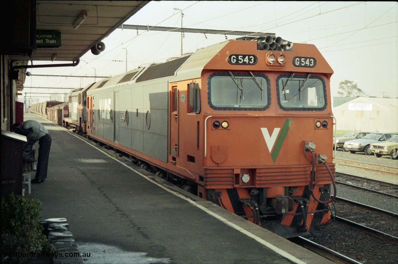 152-15
Pakenham station platform, V/Line broad gauge up 9444 goods to Nth Geelong with G class G 543 Clyde Engineering EMD model JT26C-2SS serial 89-1276 and X class X 43 Clyde Engineering EMD model G26C serial 70-706 has a crew change at the platform.
Keywords: G-class;G543;Clyde-Engineering-Somerton-Victoria;EMD;JT26C-2SS;89-1276;