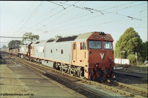 152-09
Morwell station yard, V/Line broad gauge train 9444 goods to Nth Geelong arrives into the yard from the briquette sidings behind G class G 543 Clyde Engineering EMD model JT26C-2SS serial 89-1276 and X class X 43 Clyde Engineering EMD model G26C serial 70-706, taken from station platform.
Keywords: G-class;G543;Clyde-Engineering-Somerton-Victoria;EMD;JT26C-2SS;89-1276;