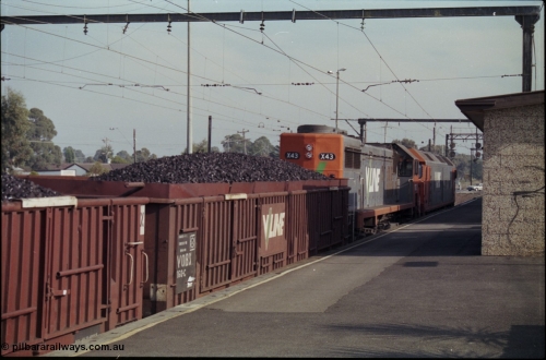 152-13
Pakenham station, V/Line broad gauge up 9444 goods to Nth Geelong with G class G 543 Clyde Engineering EMD model JT26C-2SS serial 89-1276 and X class X 43 Clyde Engineering EMD model G26C serial 70-706 and VOBX class bogie briquette waggon VOBX 160.
