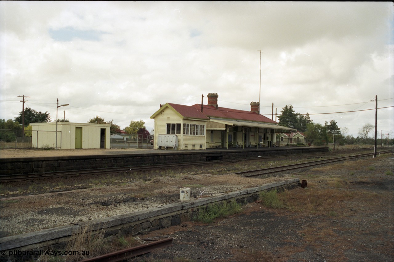 153-1-07
Ballan station overview, station shed on platform, signal box and station building, taken from goods shed platform.
