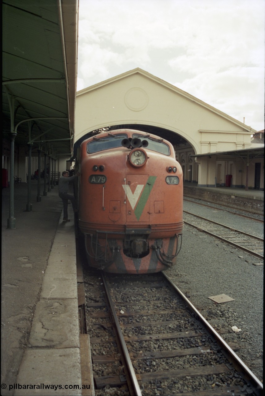 153-1-11
Ballarat station platform looking from the east end of the platform, canopy behind broad gauge V/Line A class A 79 Clyde Engineering EMD model AAT22C-2R serial 84-1188 rebuilt from B 79 Clyde Engineering EMD model ML2 serial ML2-20 at platform, driver climbing aboard.
Keywords: A-class;A79;Clyde-Engineering-Rosewater-SA;EMD;AAT22C-2R;84-1188;rebuild;bulldog;