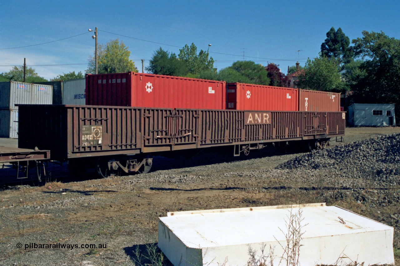 153-2-17
Ballarat station yard, broad gauge Australian National Railways AOOX type 85 foot bogie open waggon AOOX 2169 with ANR logos and three 20' TEU containers, AOOX 2169 was built by Transfield WA as one of a batch of thirty six GOX type bogie open waggons in 1970.
Keywords: AOOX-type;AOOX2169;Transfield-WA;GOX-type;