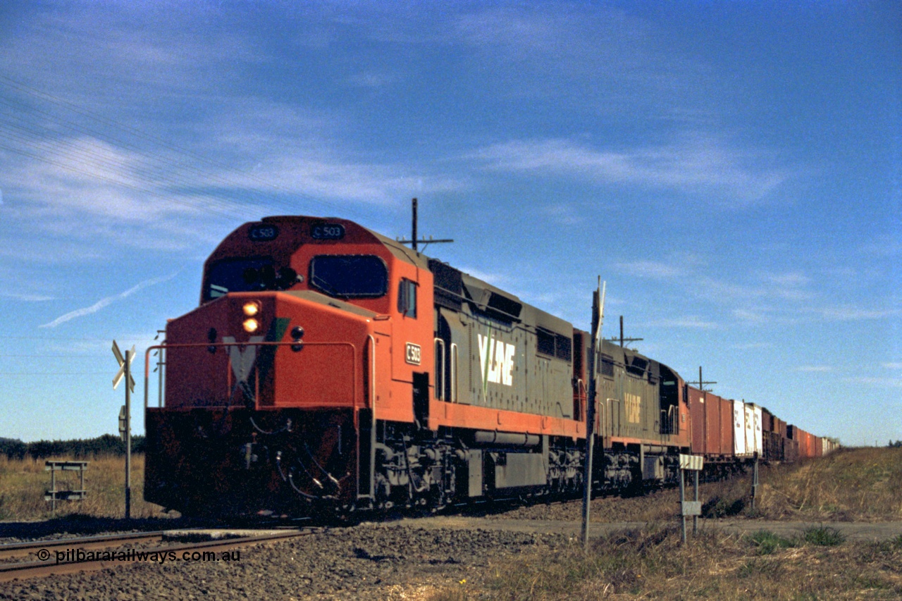 153-2-21
Trawalla, V/Line broad gauge up goods train with double C class locos C 503 Clyde Engineering EMD model GT26C serial 76-826 and a sister with train 9150 at Smiths Rd crossing.
Keywords: C-class;C503;Clyde-Engineering-Rosewater-SA;EMD;GT26C;76-826;