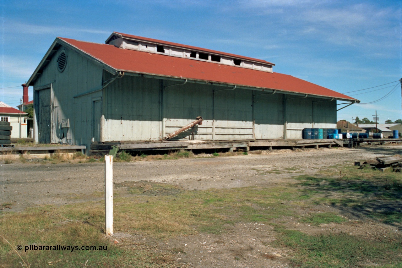 153-2-24
Beaufort goods shed, view from road side, station building and platform behind it.
