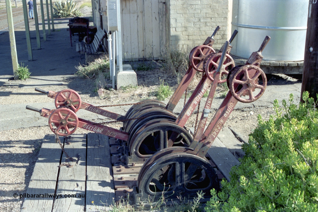 153-3-03
Maroona, station platform, signal levers chained in position, closest to camera Outer Ararat, Inner Ararat, Hamilton Dep, Geelong Dep, Hamilton Arr and Geelong Arr.
