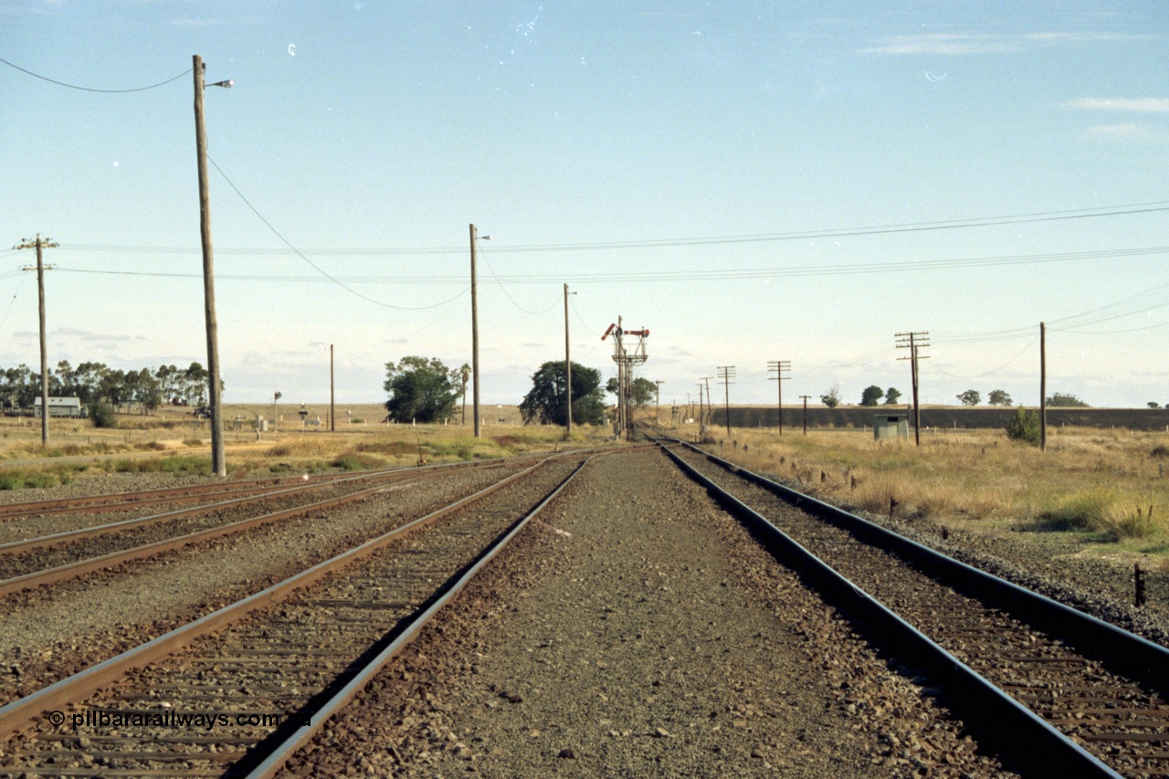 153-3-04
Maroona station yard overview looking towards Portland, junction for line to Geelong via Cressy, semaphore signal for Geelong line pulled off.
