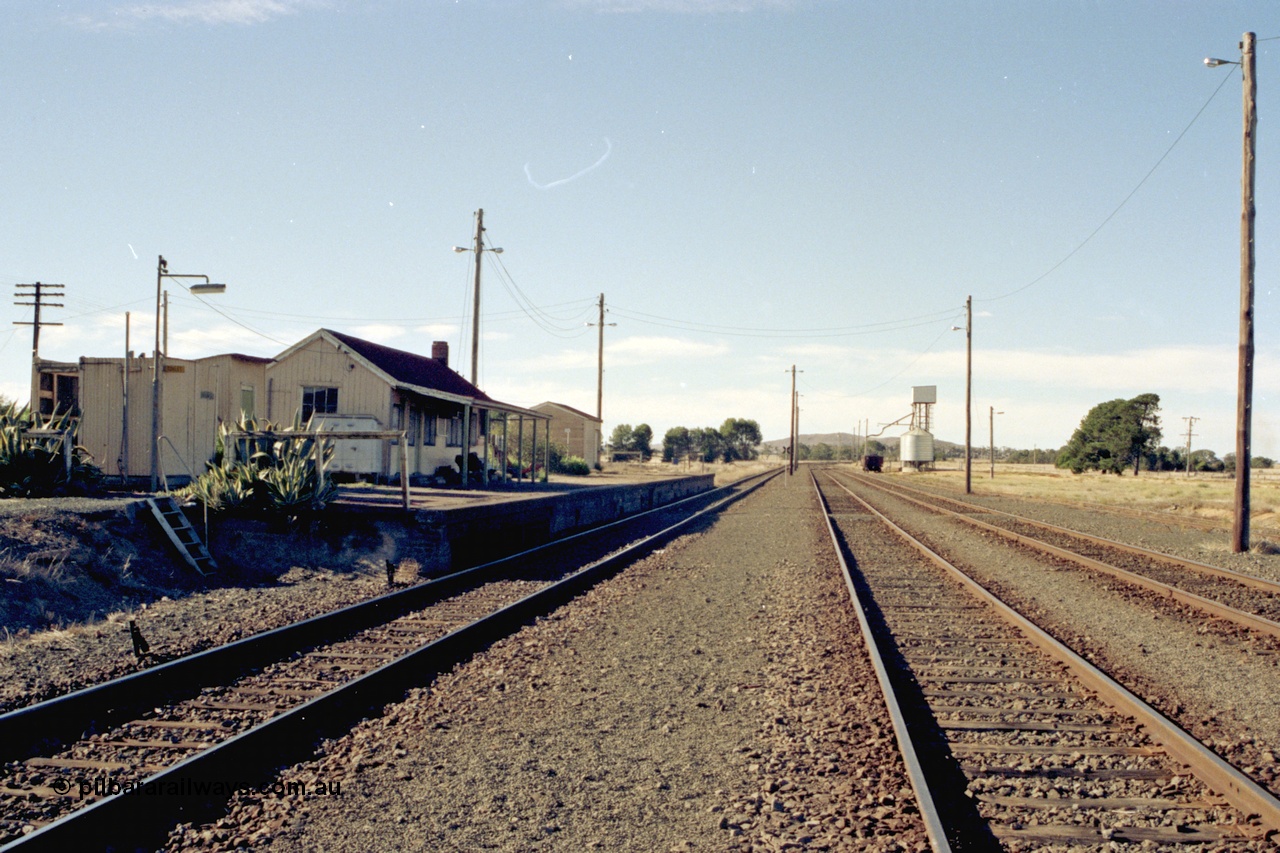 153-3-05
Maroona station yard overview, building and platform, platform shed, grain silos, looking toward Ararat.
