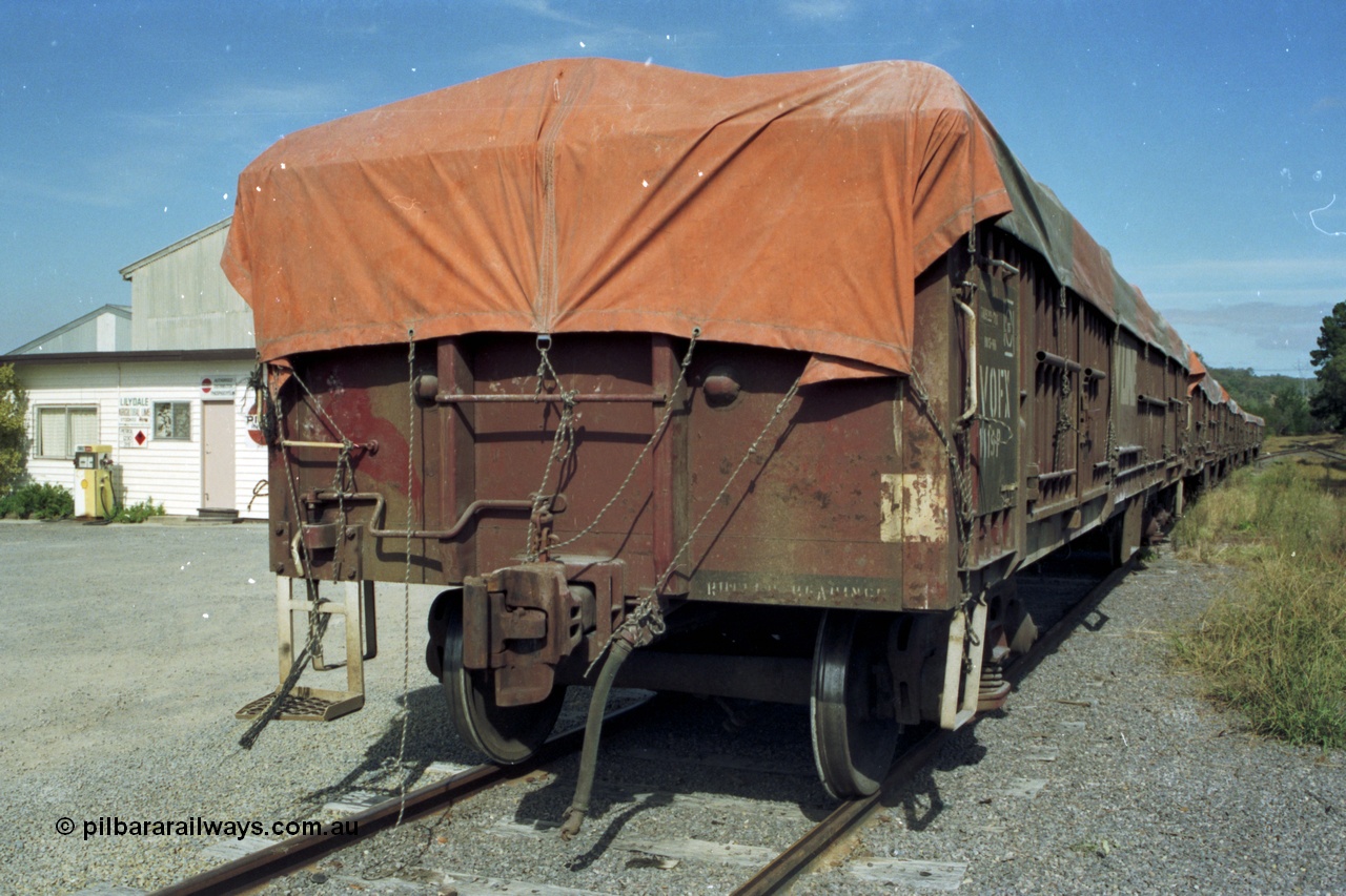 153-3-36
Coldstream, Pivot super phosphate distributor depot office and fuel bowser, V/Line VOFX type super phosphate bogie open waggons with tarpaulins VOFX 1119, built by Victorian Railways Bendigo Workshops as an VOCX type in a batch of seventy in 1978-79.
Keywords: VOFX-type;VOFX1119;Victorian-Railways-Bendigo-WS;VOCX-type;