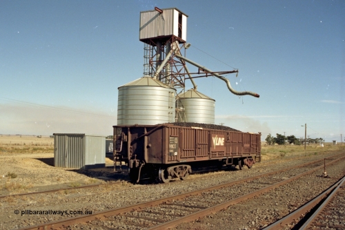 153-3-01
Maroona, V/Line VOCX type bogie open waggon VOCX 130, originally built by Victorian Railways Ballarat North Workshops an ELX type in July 1968, recoded to VOCX in 1979, loaded with briquettes at the silo load out, lever handbrake.
Keywords: VOCX-type;VOCX130;Victorian-Railways-Ballarat-Nth-WS;ELX-type