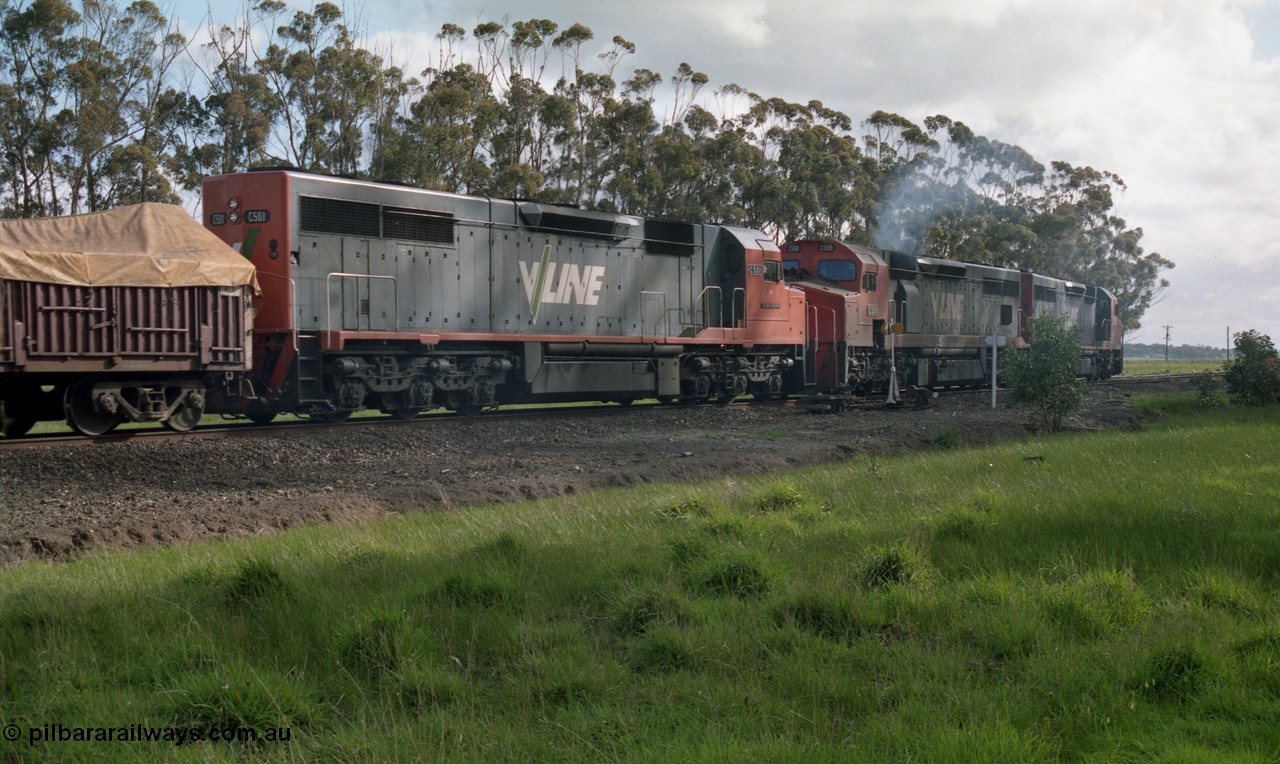 154-12
Lismore, V/Line broad gauge C class locomotives C 510 Clyde Engineering EMD model GT26C serial 76-833, C 508 serial 76-831 and C class leader C 501 'George Brown' serial 76-824 power into No.2 Rd with Adelaide bound goods train 9169 through the trailable points, point indicator and curve board are visible beside C 508.
Keywords: C-class;C501;Clyde-Engineering-Rosewater-SA;EMD;GT26C;76-824;