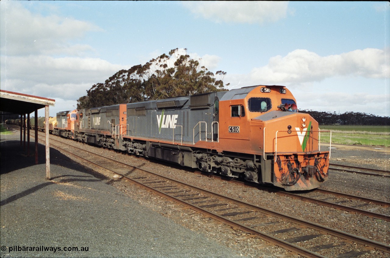 154-15
Lismore, V/Line broad gauge C class locomotive C 510 Clyde Engineering EMD model GT26C serial 76-833 leads Adelaide bound goods train 9169 with C 508 serial 76-831 and C class leader C 501 'George Brown' serial 76-824, paused on No.2 Rd opposite the station building to obtain a new train order from Lismore to Ararat.
Keywords: C-class;C510;Clyde-Engineering-Rosewater-SA;EMD;GT26C;76-833;