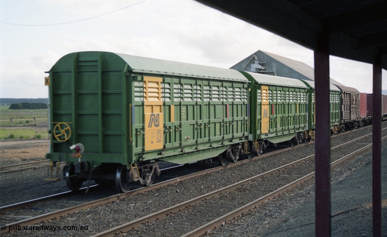 154-25
Lismore, view from station veranda, three Australian National broad gauge AHLX type bogie louvre vans in AN colours and an ANR louvre van on the rear of Adelaide bound goods train 9169.
Keywords: AHLX-type;