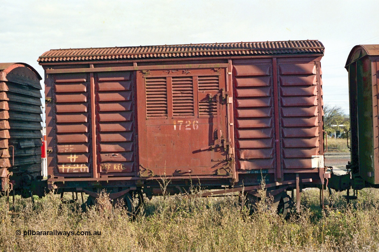 155-02
Wallan, stored 'OFF REG' waggon awaiting scrapping, four wheel waggon, short U type louvre van U 1726, side view.
Keywords: U-type;U1726;fixed-wheel-waggon;