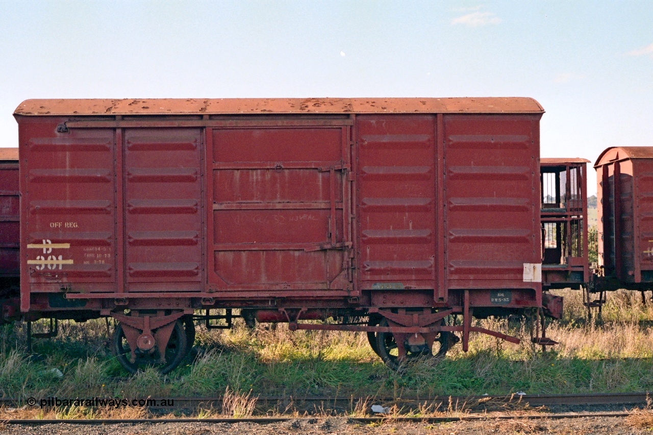 155-04
Wallan, stored 'OFF REG' waggon awaiting scrapping, four wheel waggon, B type louvre van B 301, side view.
Keywords: B-type;B301;fixed-wheel-waggon;