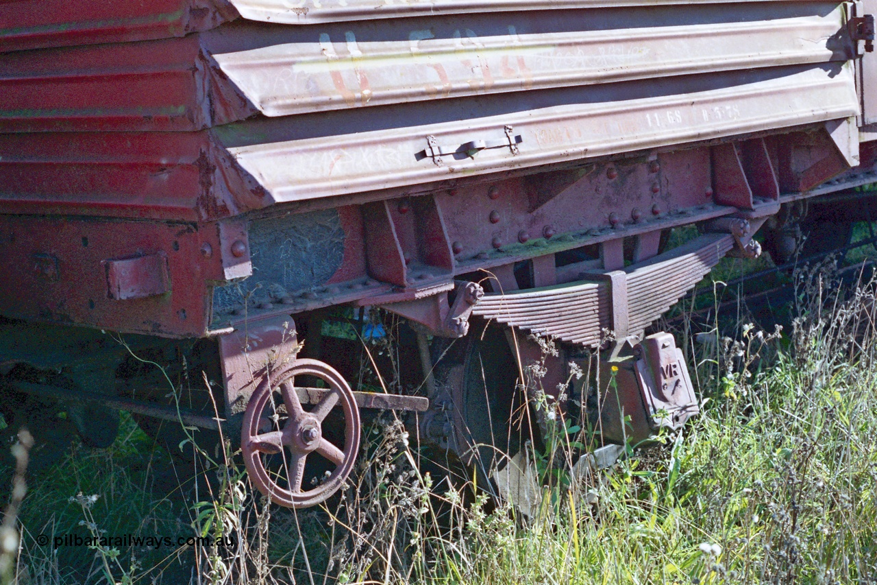 155-06
Wallan, stored 'OFF REG' waggon awaiting scrapping, four wheel waggon, U type louvre van U 594, detail view of hand brake wheel.
Keywords: U-type;U594;fixed-wheel-waggon;