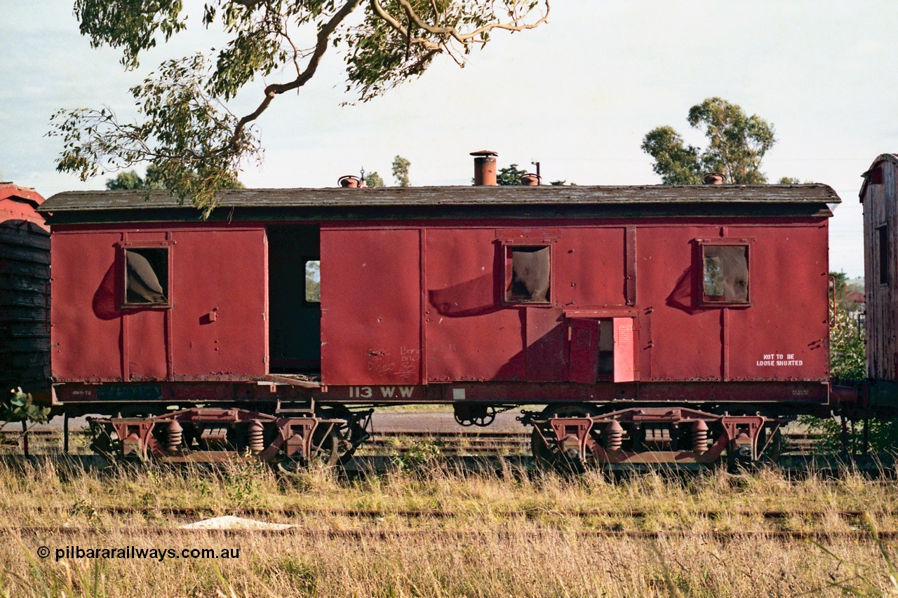 155-10
Wallan, stored 'OFF REG' waggon awaiting scrapping, bogie Ways and Works workmen's sleeper waggon, WW type 113 WW, side view. Originally built as a A type first class fixed six wheel carriage A 114 by Brown & Marshall of England in 1883, recoded to X type X 63 in circa 1910, then in 1946 converted to a workman's sleeper W type at Newport workshops as W 58. And in 1959 at Bendigo workshops fitted to a bogie underframe and converted to WW.
Keywords: WW-type;WW113;Brown&Marshall;A-type;A114;X-type;X63;W-type;W58;