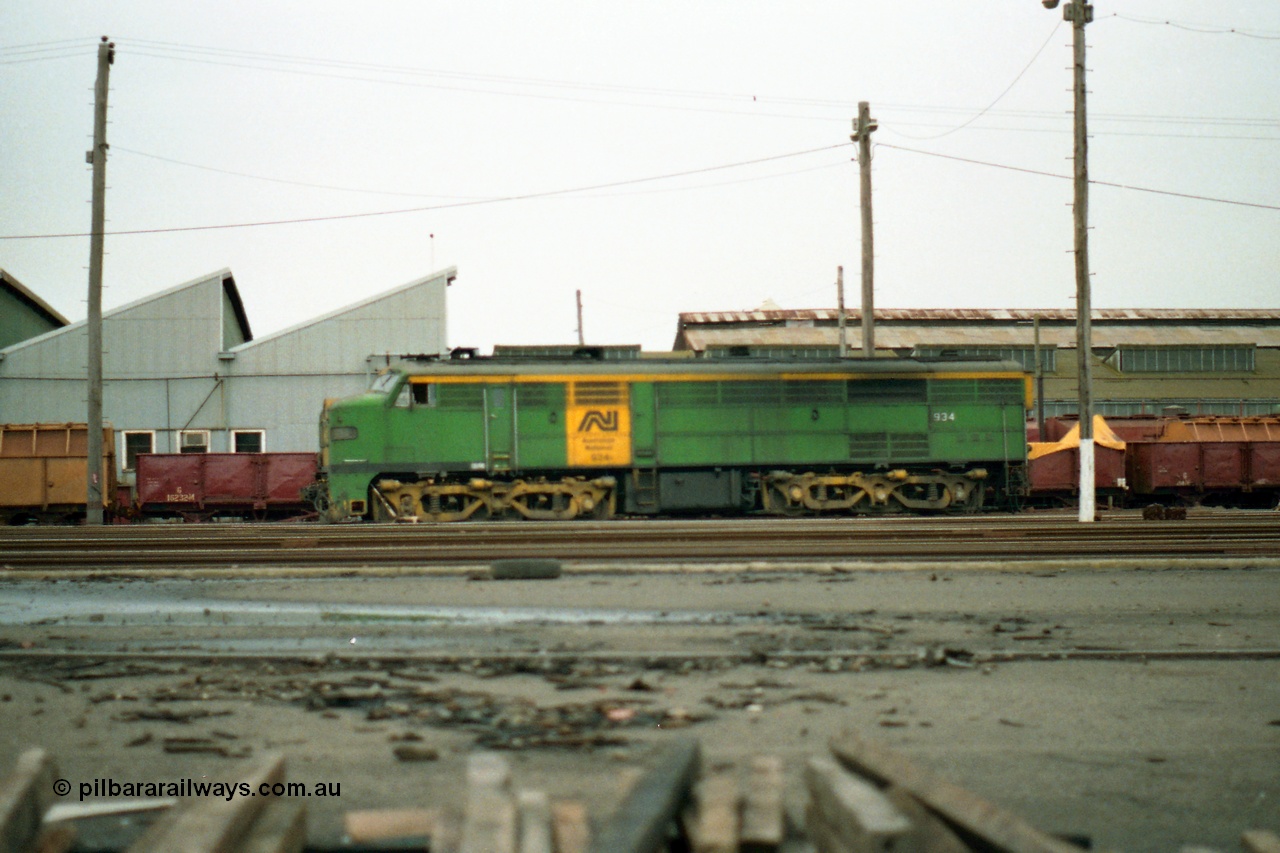 155-23
Melbourne Yard, derailed broad gauge Australian National 930 class 934 built in 1956 by AE Goodwin as ALCo model DL500B serial 81889 in AN livery, side view, off focus.
Keywords: 930-class;934;AE-Goodwin;ALCo;DL500B;81889;