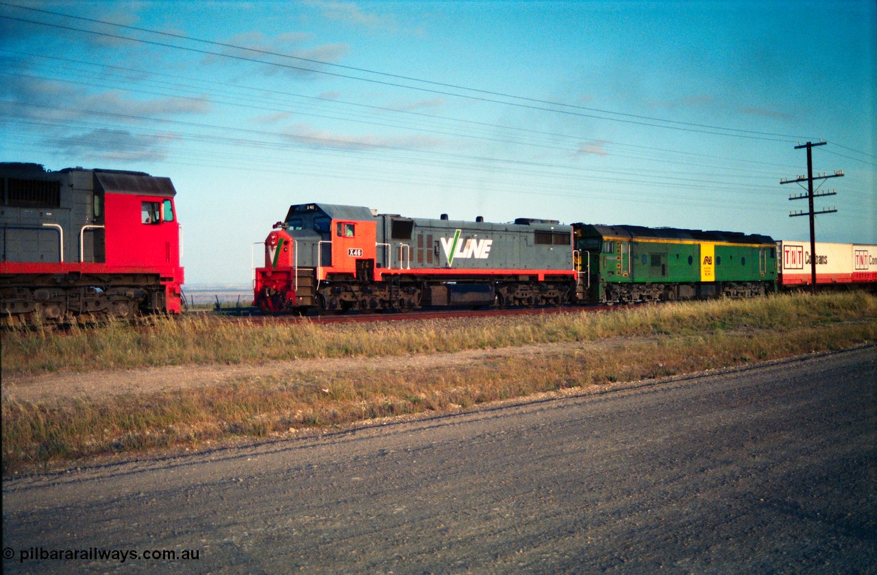 156-01
Bank Box Loop, broad gauge V/Line N class N 471 'City of Benalla' Clyde Engineering EMD model JT22HC-2 serial 87-1200 sits on the loop as V/Line X class X 46 Clyde Engineering EMD model G26C serial 75-793 and Australian National BL class leader BL 26 'Bob Hawke' Clyde Engineering EMD model JT26C-2SS serial 83-1010 leads an Adelaide bound Super Freighter on the mainline.
Keywords: N-class;N471;Clyde-Engineering-Somerton-Victoria;EMD;JT22HC-2;87-1200;