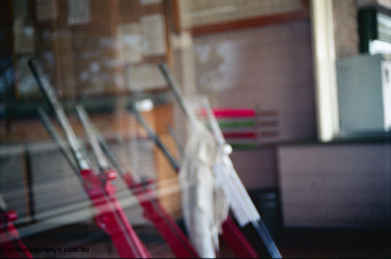 156-22
Numurkah, station building, internal view of lever frame, signal levers, taken through window, off focus.
